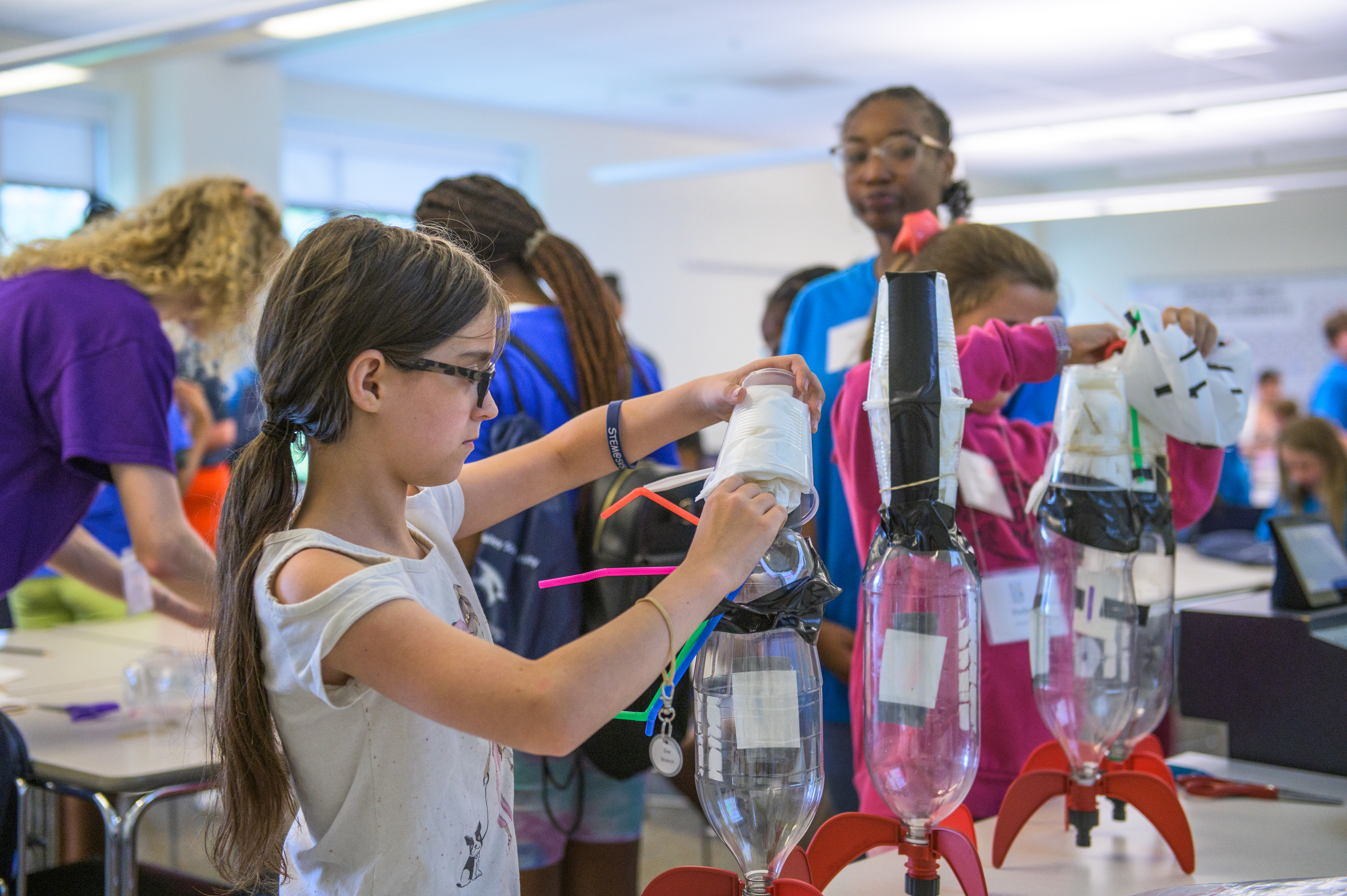 Student building a hydro rocket.
